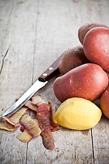 Image showing  peeled potatoes and knife