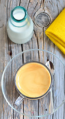 Image showing Cup of coffee on a wooden table