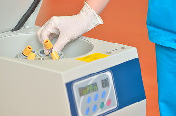 Image showing blood tube in to centrifuge