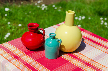 Image showing ceramic colored vase red striped surface outdoor 