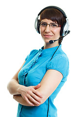 Image showing Beautiful young girl in headphones with a microphone. isolated o