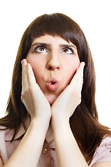 Image showing Surprised young woman on an isolated white