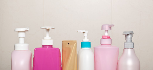 Image showing Row of toiletry bottles