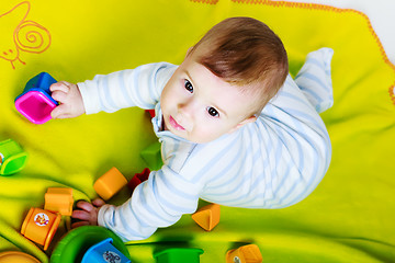 Image showing Little baby boy with toys