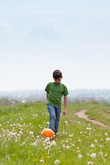 Image showing Cute boy with football outdoors