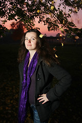 Image showing Happy young brunette in autumn park 