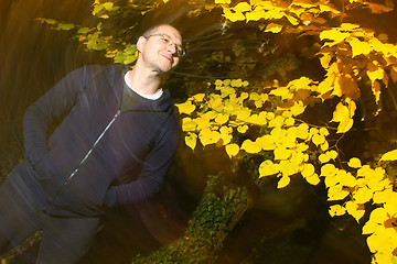 Image showing Man in autumn park enjoys