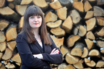 Image showing Business woman with wood background