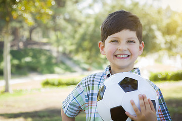 Image showing Cute Young Boy Playing with Soccer Ball in Park