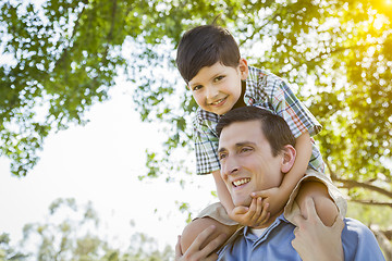 Image showing Father and Son Playing Piggyback in the Park