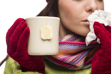 Image showing Young Sick Woman Holding Cup with Blank Tea Bag Hanging