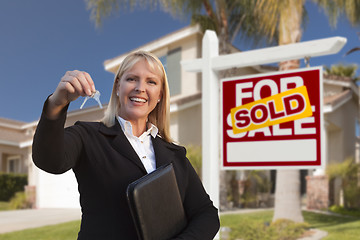 Image showing Female Real Estate Agent Handing Over the House Keys