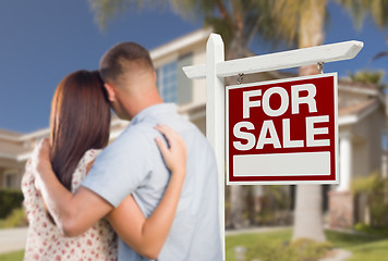 Image showing For Sale Real Estate Sign, Military Couple Looking at House