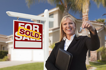 Image showing Female Real Estate Agent Handing Over the House Keys