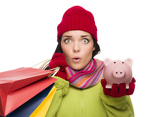 Image showing Concerned Mixed Race Woman Holding Shopping Bags and Piggybank