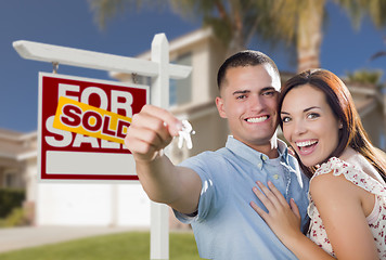 Image showing Military Couple In Front of Home, House Keys and Sign