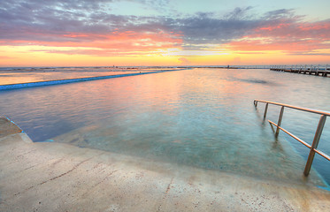 Image showing Sunrise from one of the pools to the ocean at North Narrabeen Au