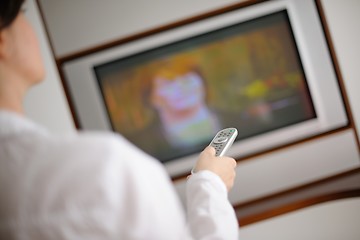 Image showing happy young woman relax at home on sofa