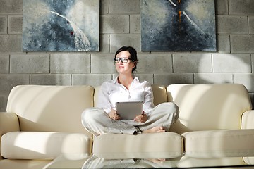 Image showing woman using tablet pc at home