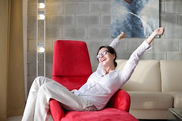 Image showing happy young woman relax at home on sofa