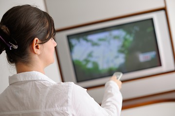 Image showing happy young woman relax at home on sofa