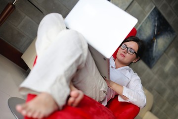 Image showing woman using a laptop computer at home