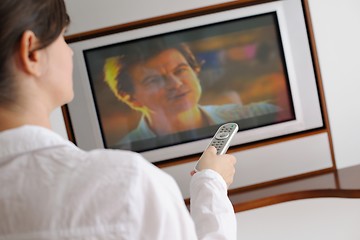 Image showing happy young woman relax at home on sofa