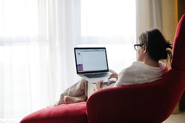 Image showing woman using a laptop computer at home