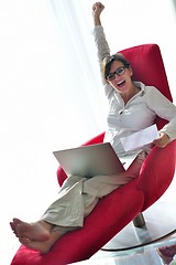 Image showing woman using a laptop computer at home