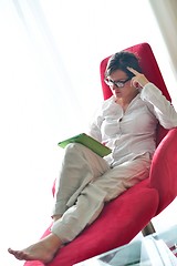 Image showing woman using tablet pc at home