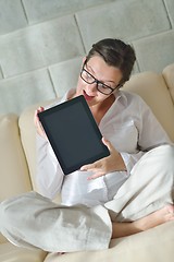 Image showing woman using tablet pc at home