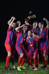 Image showing soccer players celebrating victory