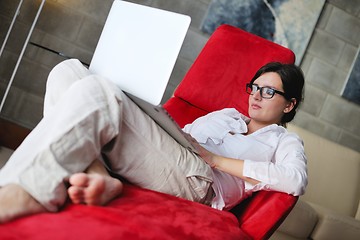 Image showing woman using a laptop computer at home