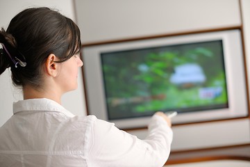 Image showing happy young woman relax at home on sofa