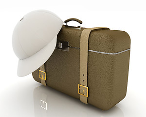 Image showing Brown traveler's suitcase and peaked cap 