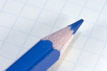 Image showing Blue pencil on notepad