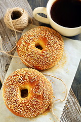 Image showing Bagels with sesame seeds and black coffee. 