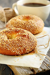 Image showing Breakfast. Sweet bagels with sesame seeds and coffee.