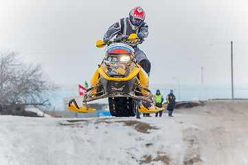 Image showing Jump of sportsman on snowmobile