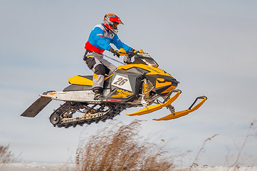 Image showing High jump of sportsman on snowmobile