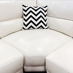 Image showing White leather sofa with decorative cushion