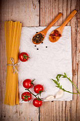 Image showing uncooked pasta with tomatoes and spices 