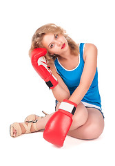 Image showing Pretty sad girl with boxing gloves