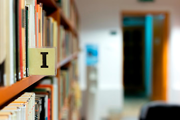 Image showing Library bookshelf closeup with letter