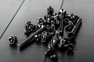 Image showing Design black screws on metal plate