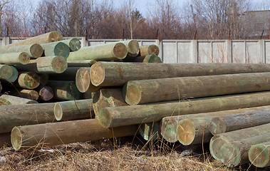 Image showing Storing wood in open spaces 