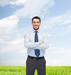 Image showing handsome businessman with crossed arms