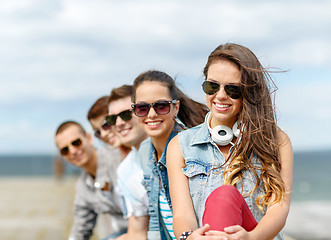 Image showing smiling teenage girl hanging out with friends