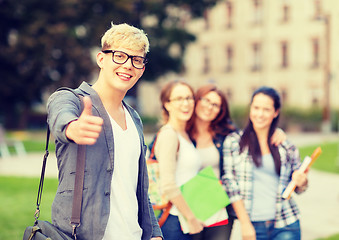 Image showing male student in eyglasses showing thumbs up