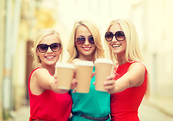 Image showing women with takeaway coffee cups in the city